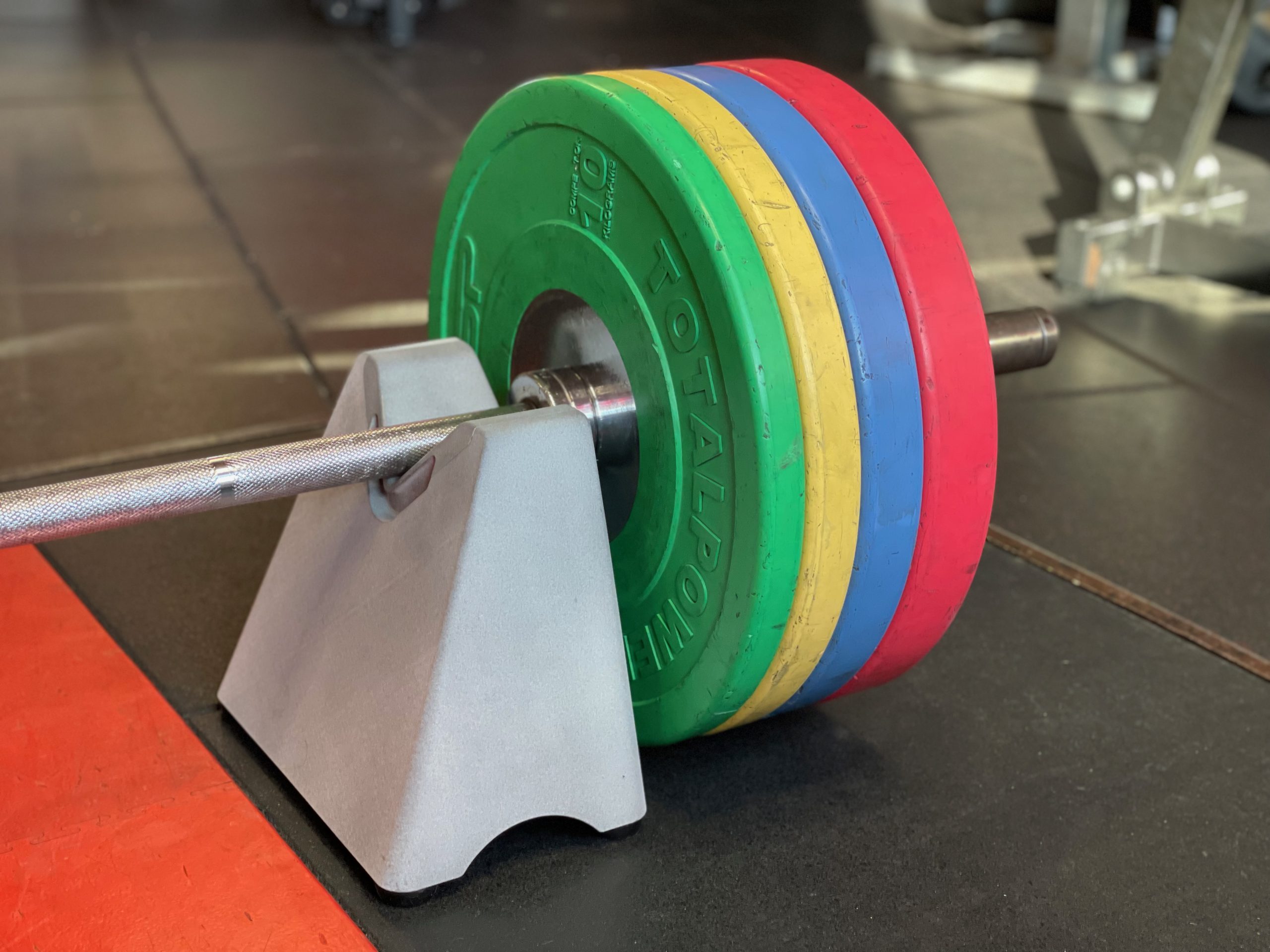 Barbell loaded with plates on BarBuddi